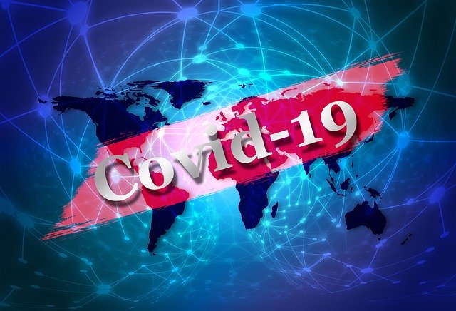 Covid-19 teksti, maailmankartta taustalla